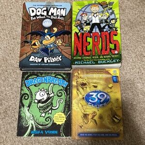 Books (4) "Dog Man", "Nerds", "Dragon Breath", "39 Clues"